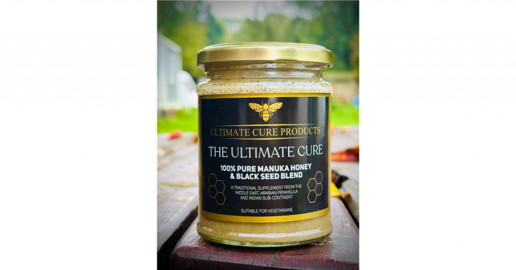 Raw manuka honey and black seed blend in a jar.